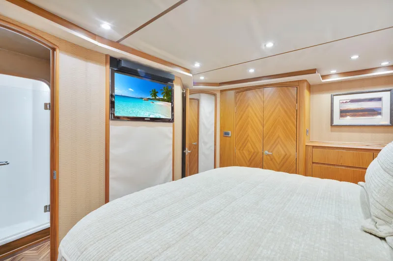 Slide: The Image of Luxurious interior of 2011 Viking 70 Convertible yacht with elegant wood finishes and modern amenities. - 16