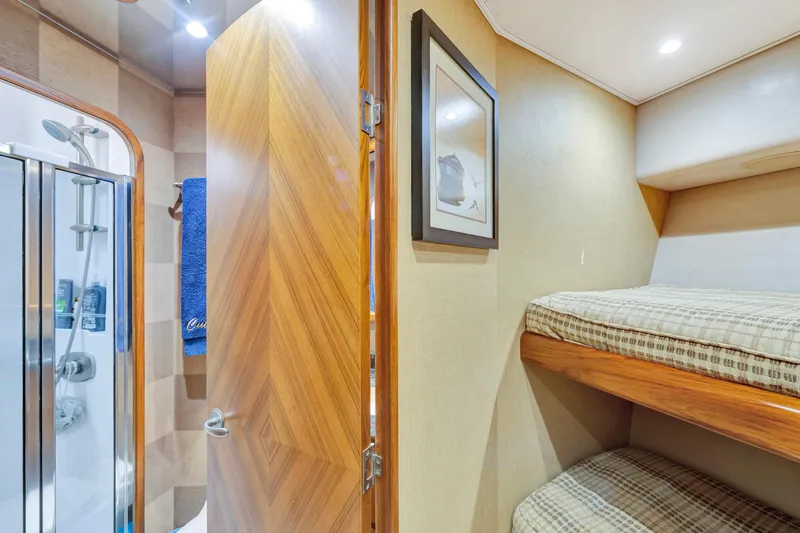 Slide: The Image of Interior of 2011 Viking 70 Convertible yacht with bunk beds and bathroom. - 20