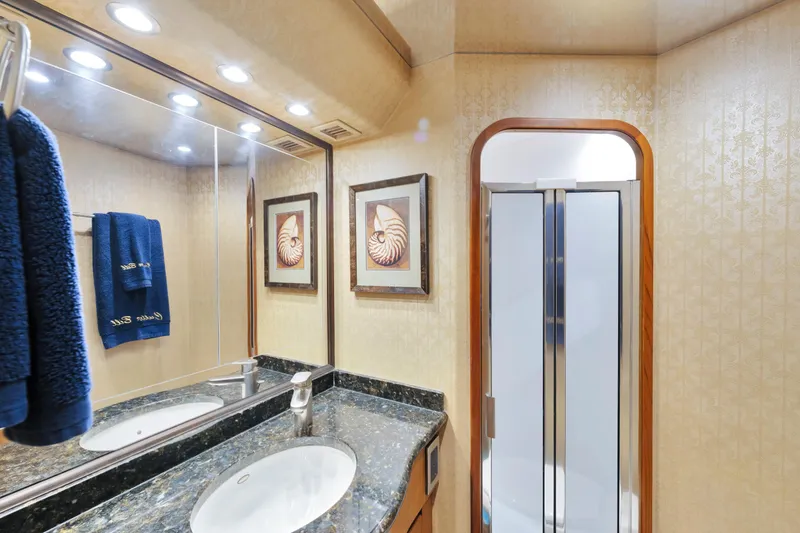 Slide: The Image of Luxurious bathroom in 2011 Viking 70 Convertible yacht with elegant decor and modern fixtures. - 27