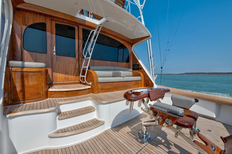 Slide: The Image of Luxurious 2011 Viking 70 Convertible yacht deck with wooden finishes and ocean view. - 28