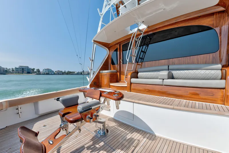 Slide: The Image of Luxurious 2011 Viking 70 Convertible yacht with elegant deck and seating area. - 29