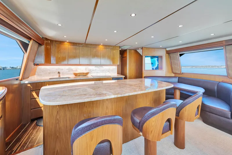 Slide: The Image of Luxurious interior of 2011 Viking 70 Convertible yacht with elegant wood finishes and ocean view. - 3