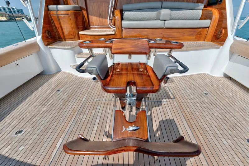 Slide: The Image of Luxury teak deck of 2011 Viking 70 Convertible yacht with elegant seating and fishing chair. - 32