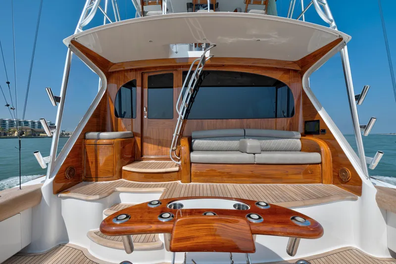 Slide: The Image of Luxurious 2011 Viking 70 Convertible yacht interior with polished wood and comfortable seating. - 33