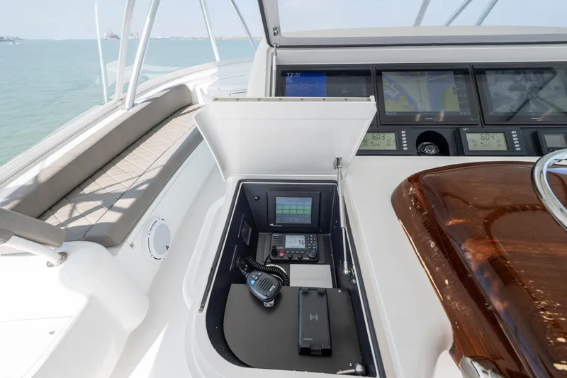 Slide: The Image of Helm of 2011 Viking 70 Convertible yacht with navigation controls and ocean view. - 37