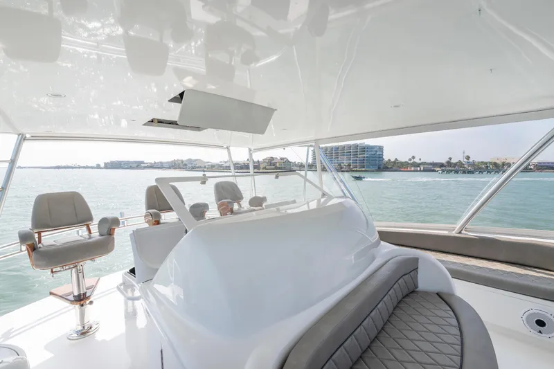 Slide: The Image of Bow view from a 2011 Viking 70 Convertible yacht on open water. - 43