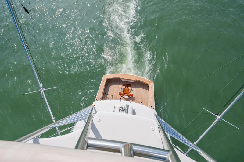 Slide: The Image of Steering console of 2011 Viking 70 Convertible yacht overlooking calm blue waters. - 47