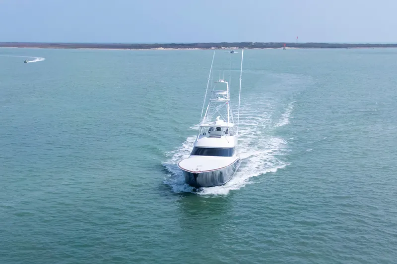 Slide: The Image of 2011 Viking 70 Convertible yacht deck with ocean view and sleek design. - 52