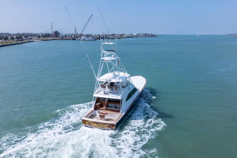 Slide: The Image of 2011 Viking 70 Convertible yacht cruising on open water. - 55