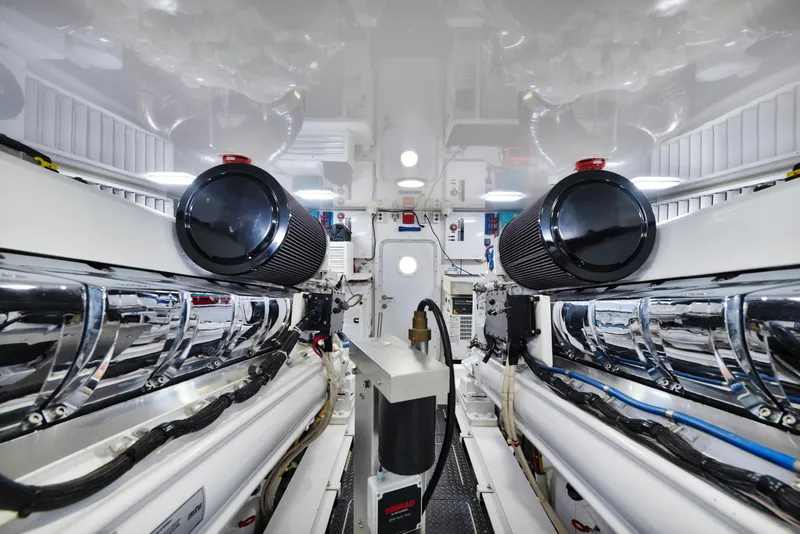 Slide: The Image of 2011 Viking 70 Convertible yacht cruising on open water under clear blue skies. - 60