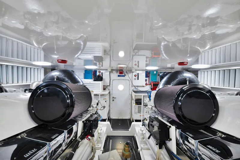 Slide: The Image of Engine room of 2011 Viking 70 Convertible yacht, featuring dual engines and sleek design. - 63