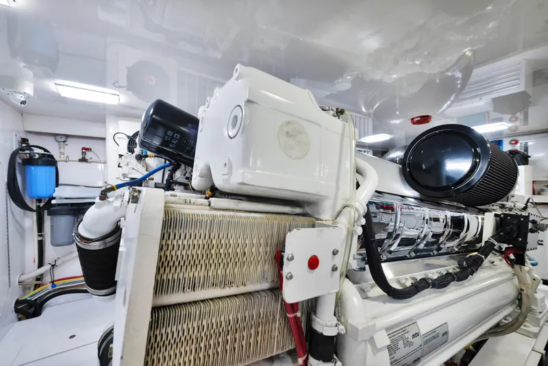 Slide: The Image of Engine room of 2011 Viking 70 Convertible yacht, showcasing advanced machinery and components. - 64