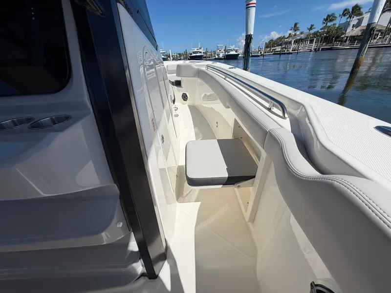 Slide: The Image of The 2026 Boston Whaler 330 Outrage features a sleek, modern interior with comfortable seating. - 35