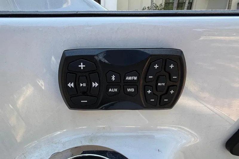 Slide: The Image of Control panel on 2024 Yamaha Boats 252SE, featuring audio and Bluetooth functions. - 13