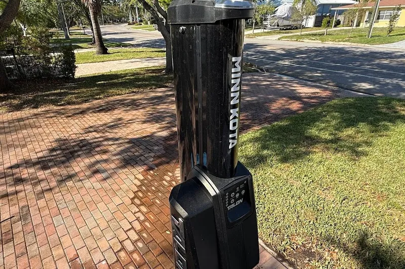 Slide: The Image of Minn Kota Talon shallow water anchor on brick driveway, sunny day. - 14
