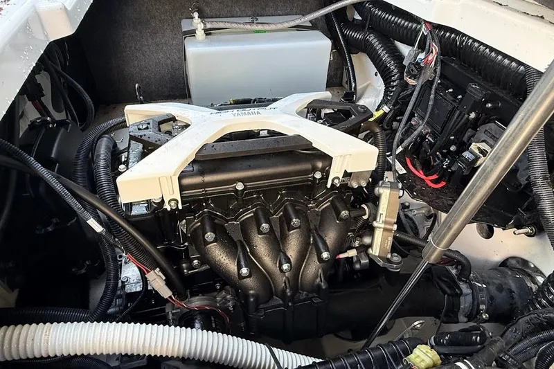 Slide: The Image of Engine compartment of 2024 Yamaha Boats 252SE, showcasing intricate mechanical components. - 17