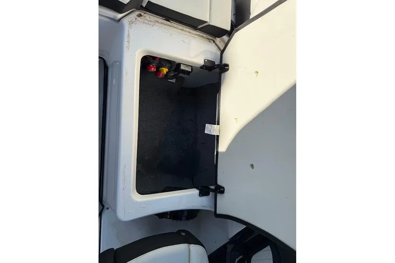 Slide: The Image of Open storage compartment on 2024 Yamaha Boats 252SE, showcasing interior space and design. - 20