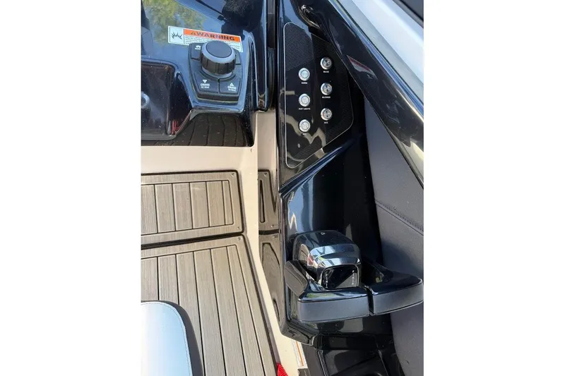 Slide: The Image of 2024 Yamaha Boats 252SE control panel with sleek black design and modern features. - 24