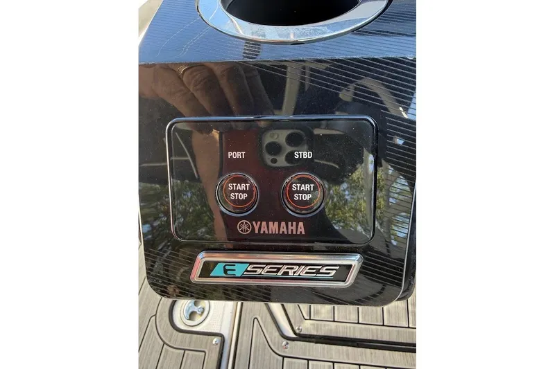 Slide: The Image of 2024 Yamaha Boats 252SE dashboard with start/stop buttons and E-Series branding. - 26