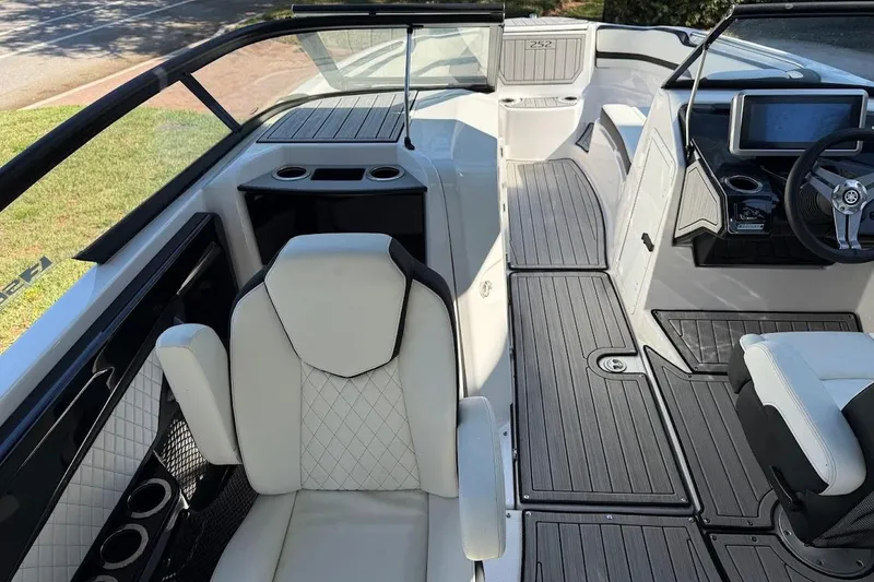 Slide: The Image of 2024 Yamaha Boats 252SE interior with modern seating and sleek dashboard design. - 5