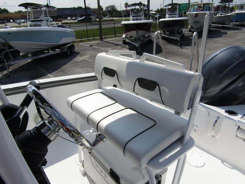 Slide: The Image of 2024 Wellcraft 202 Fisherman boat interior with dual seats and steering wheel. - 13