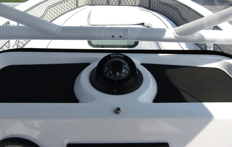 Slide: The Image of 2024 Wellcraft 202 Fisherman boat dashboard with compass. - 15