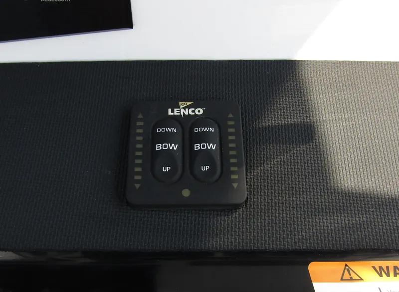 Slide: The Image of Lenco trim tab control panel on 2024 Wellcraft 202 Fisherman boat. - 18