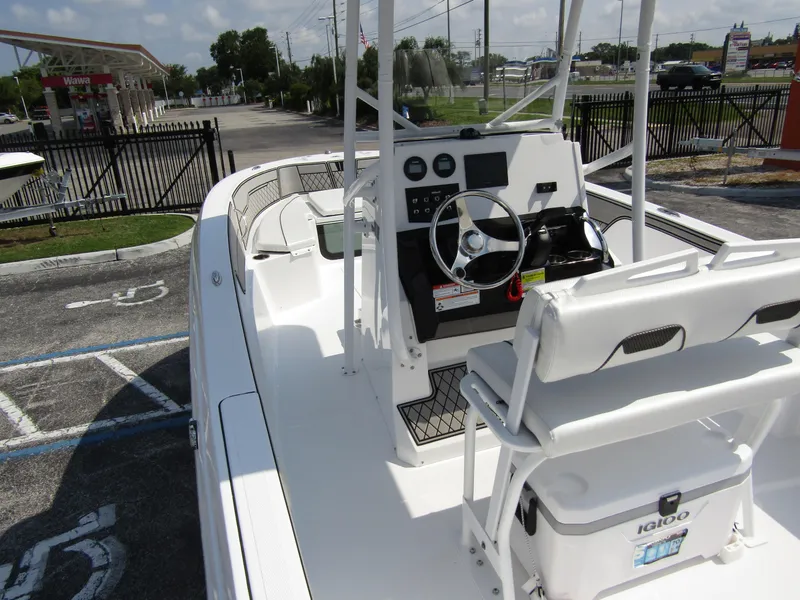 Slide: The Image of 2024 Wellcraft 202 Fisherman boat interior with steering console and seating. - 26