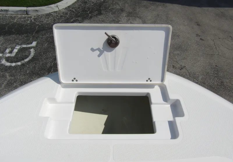 Slide: The Image of Open storage compartment on 2024 Wellcraft 202 Fisherman boat. - 5