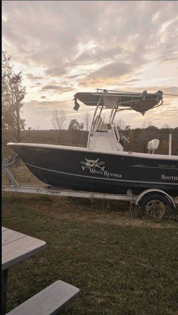 Slide: The Image of 2013 Sea Hunt Ultra 196 boat on trailer at sunset. - 4