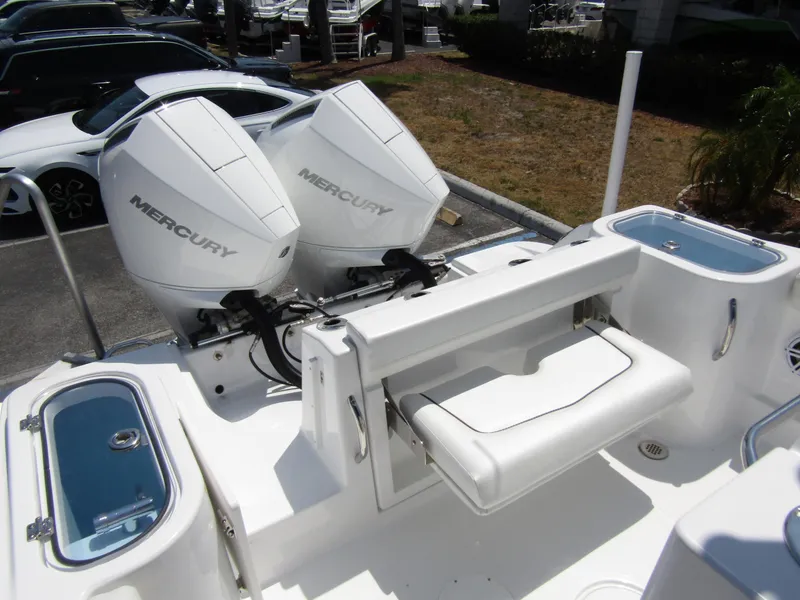Slide: The Image of 2024 Wellcraft 243 Fisherman boat with dual Mercury outboard engines. - 31