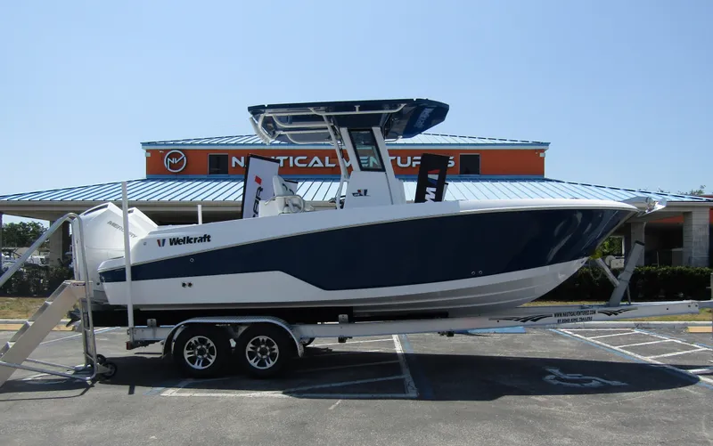 Slide: The Image of 2024 Wellcraft 243 Fisherman boat on trailer at Nautical Ventures dealership. - 4