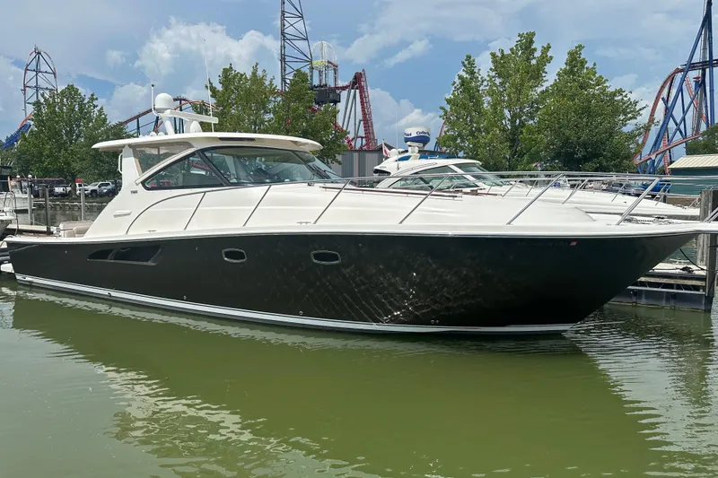 The Image of 2014 Tiara Yachts 4300 Open docked near amusement park rides. - 14
