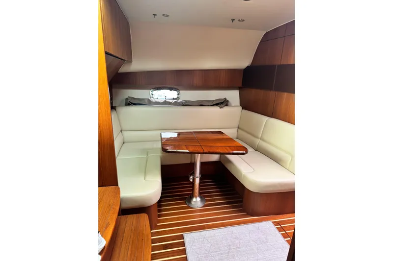 Slide: The Image of Luxurious interior of 2014 Tiara Yachts 4300 Open with elegant wood and leather seating. - 19