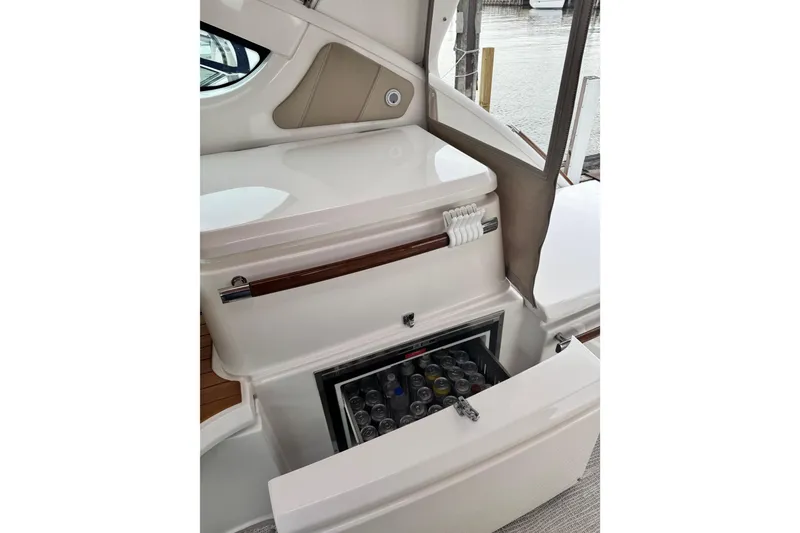 Slide: The Image of 2014 Tiara Yachts 4300 Open with open cooler stocked with beverages. - 25