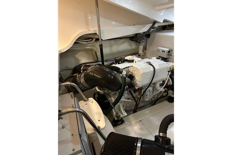 Slide: The Image of Engine room of 2014 Tiara Yachts 4300 Open, showcasing clean and organized machinery. - 30