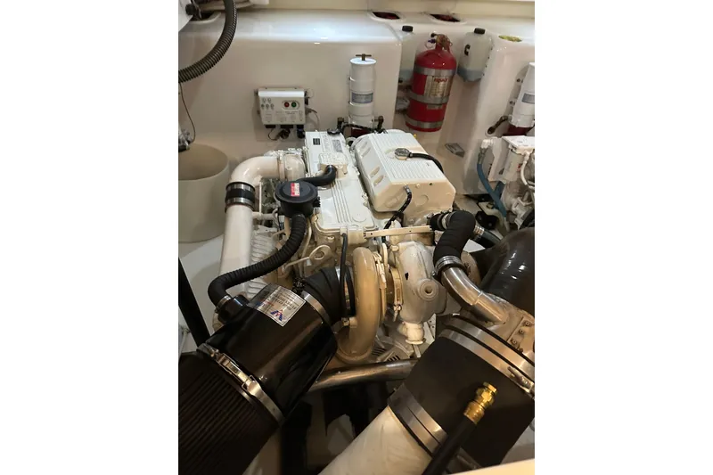 Slide: The Image of Engine room of 2014 Tiara Yachts 4300 Open, showcasing detailed mechanical components. - 32