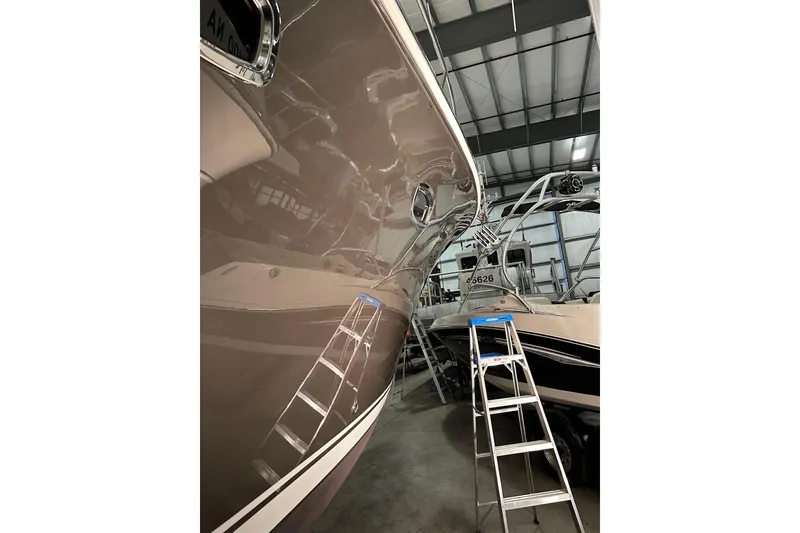 Slide: The Image of 2014 Tiara Yachts 4300 Open in storage, with ladder beside hull. - 36