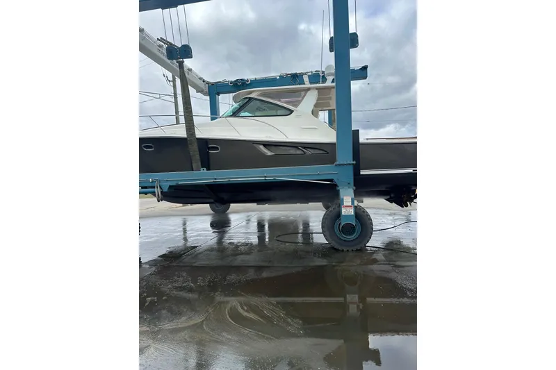 Slide: The Image of 2014 Tiara Yachts 4300 Open on a lift, showcasing sleek design and craftsmanship. - 38