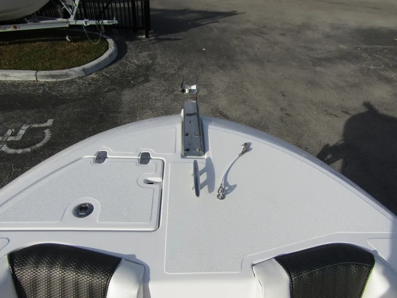 Slide: The Image of Bow of 2025 Wellcraft 243 Fisherman boat with anchor mount and storage hatches. - 6