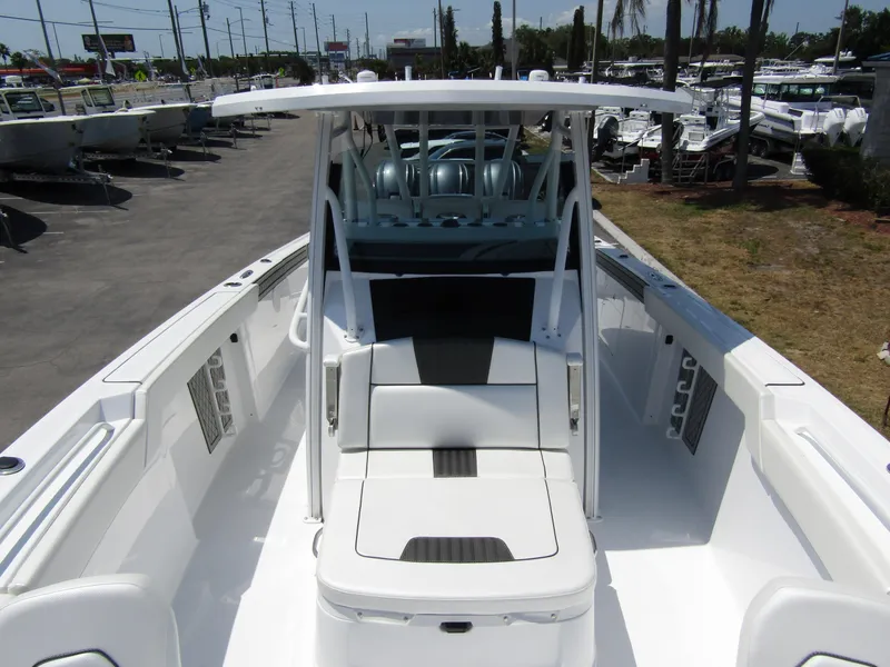 Slide: The Image of 2024 Wellcraft 352 Fisherman boat, spacious deck, modern seating, and sleek design. - 10