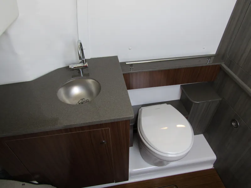 Slide: The Image of 2024 Wellcraft 352 Fisherman boat bathroom with sink and toilet - 14