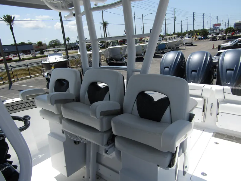 Slide: The Image of 2024 Wellcraft 352 Fisherman boat with triple seating and outboard engines. - 16
