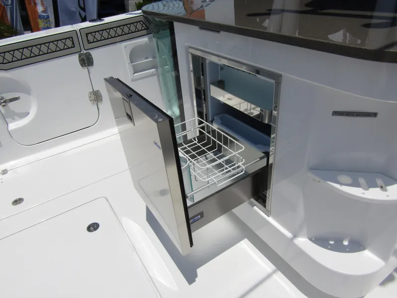 Slide: The Image of 2024 Wellcraft 352 Fisherman boat with open storage compartment. - 36