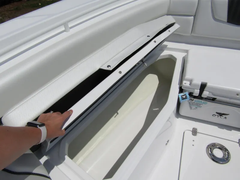 Slide: The Image of 2024 Wellcraft 352 Fisherman boat storage compartment and cooler. - 7