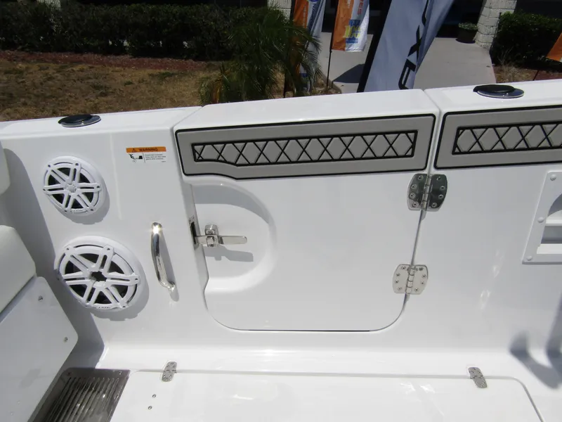 Slide: The Image of 2024 Wellcraft 352 Fisherman boat deck with speakers and storage compartments. - 32