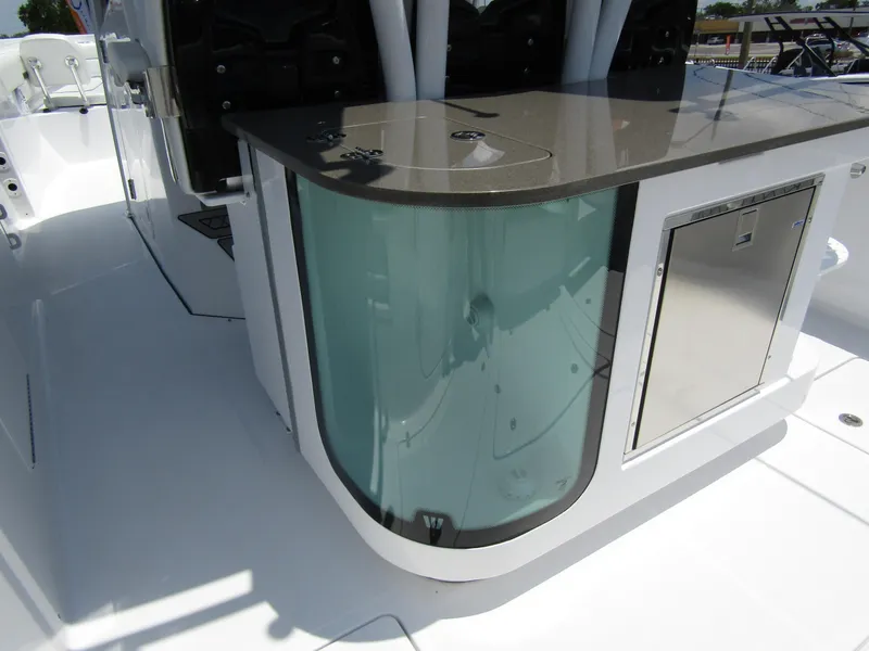 Slide: The Image of 2024 Wellcraft 352 Fisherman boat interior with sleek countertop and storage. - 39