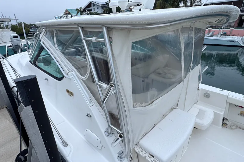 Slide: The Image of 2006 Tiara Yachts 3600 Open with enclosed cockpit, docked at marina. - 11