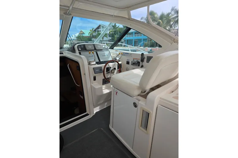 Slide: The Image of 2006 Tiara Yachts 3600 Open helm with modern controls and comfortable seating. - 16