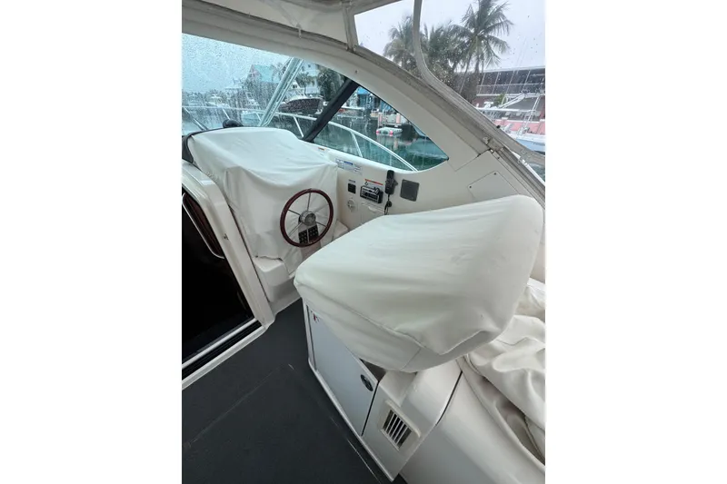 Slide: The Image of 2006 Tiara Yachts 3600 Open cockpit with covered helm and seating, marina view. - 19